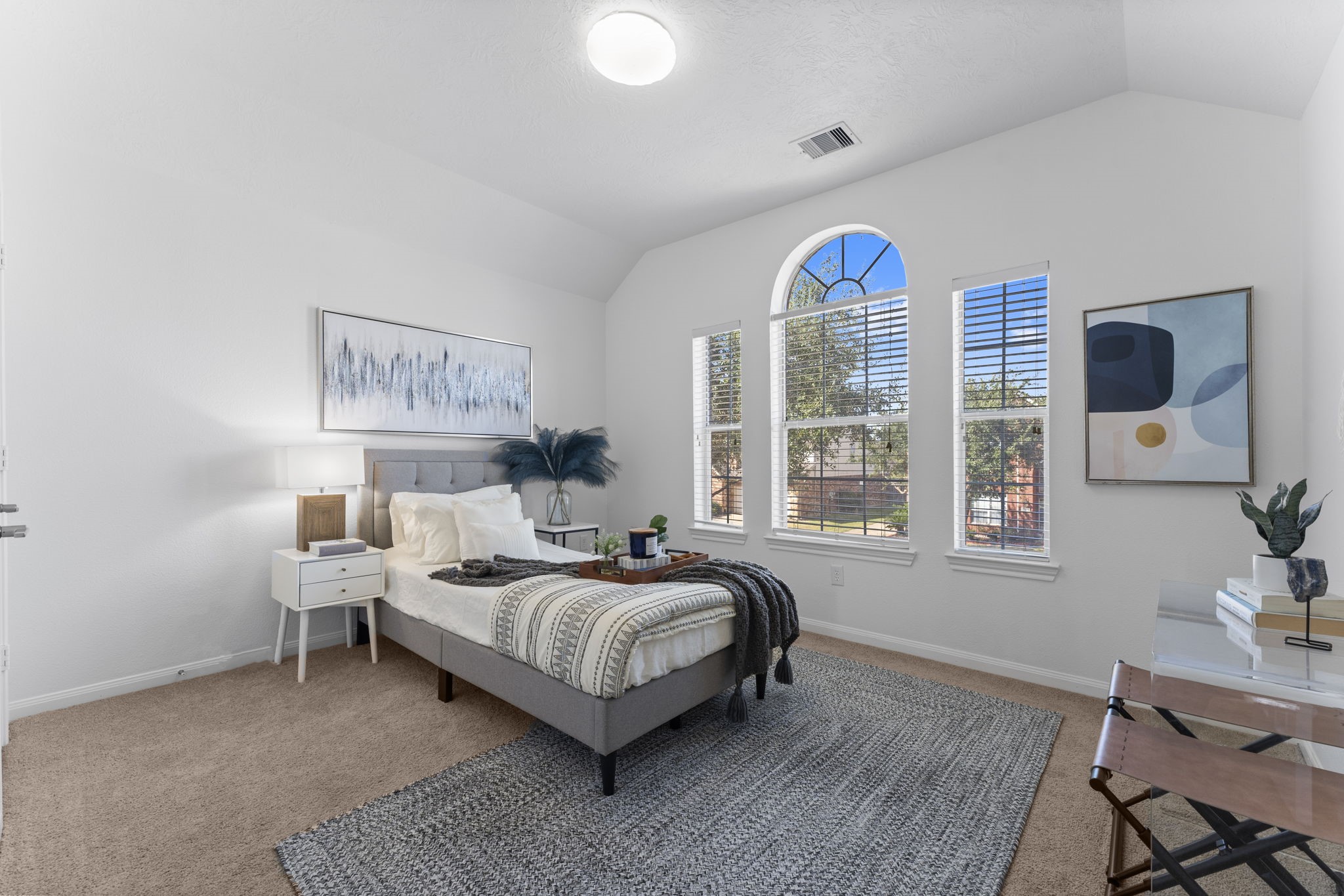 21418 Avalon Queen Drive Spring, TX 77379 - Photo 25 of 35 a bedroom with a bed and a table in it with window
