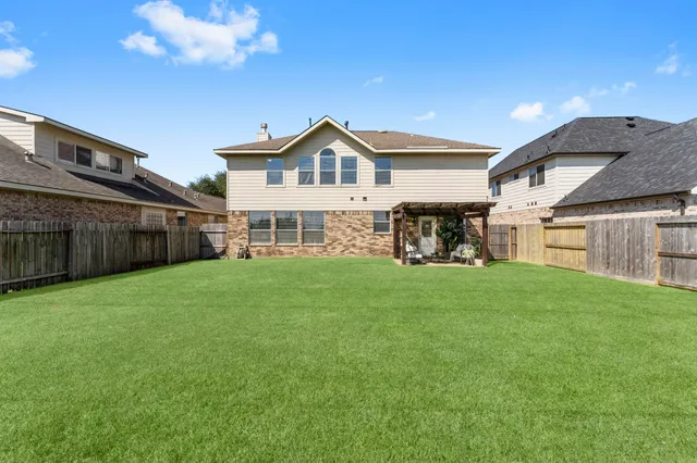 a swimming pool with outdoor seating