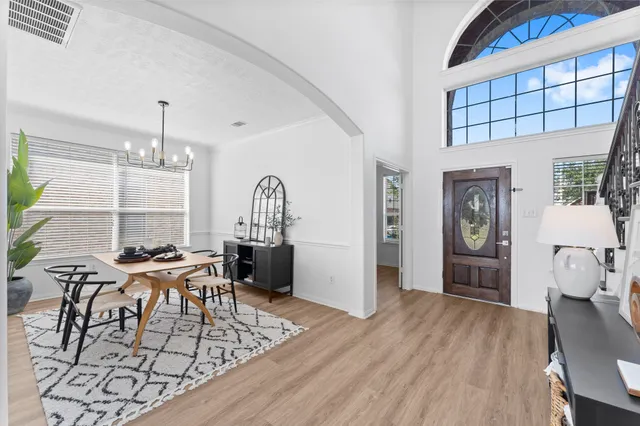 a view of a livingroom with furniture and wooden floor