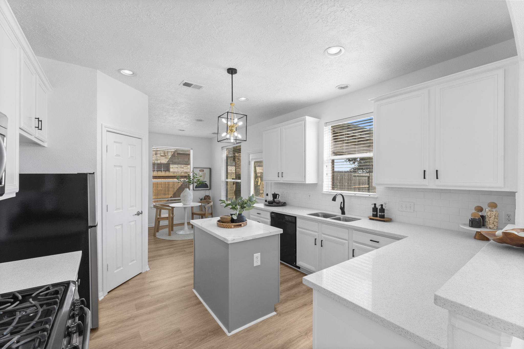 21418 Avalon Queen Drive Spring, TX 77379 - Photo 7 of 35 a kitchen that has a lot of cabinets a sink and appliances in it