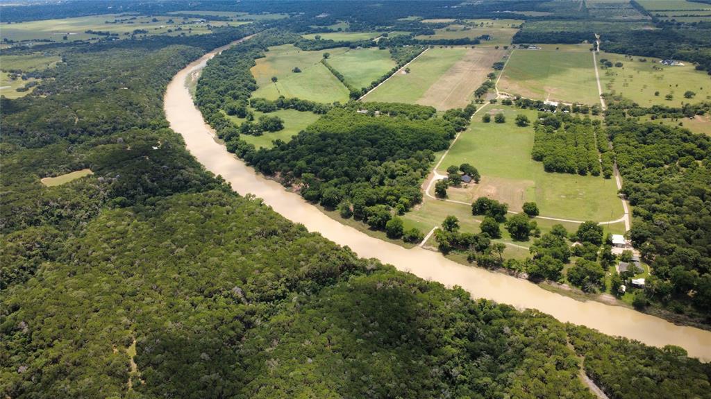 3175 Clater Powell Road Waco, TX 76705 - Photo 5 of 19 a view of a garden with a wooden bridge