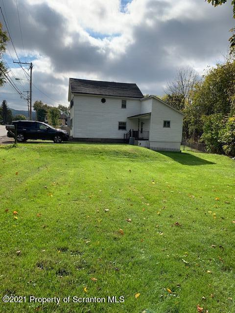 681 Main Street Great Bend, PA 18821 - Photo 2 of 22 a front view of house with yard and trees in the background