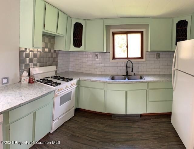 681 Main Street Great Bend, PA 18821 - Photo 8 of 22 a kitchen with a sink cabinets and wooden floor