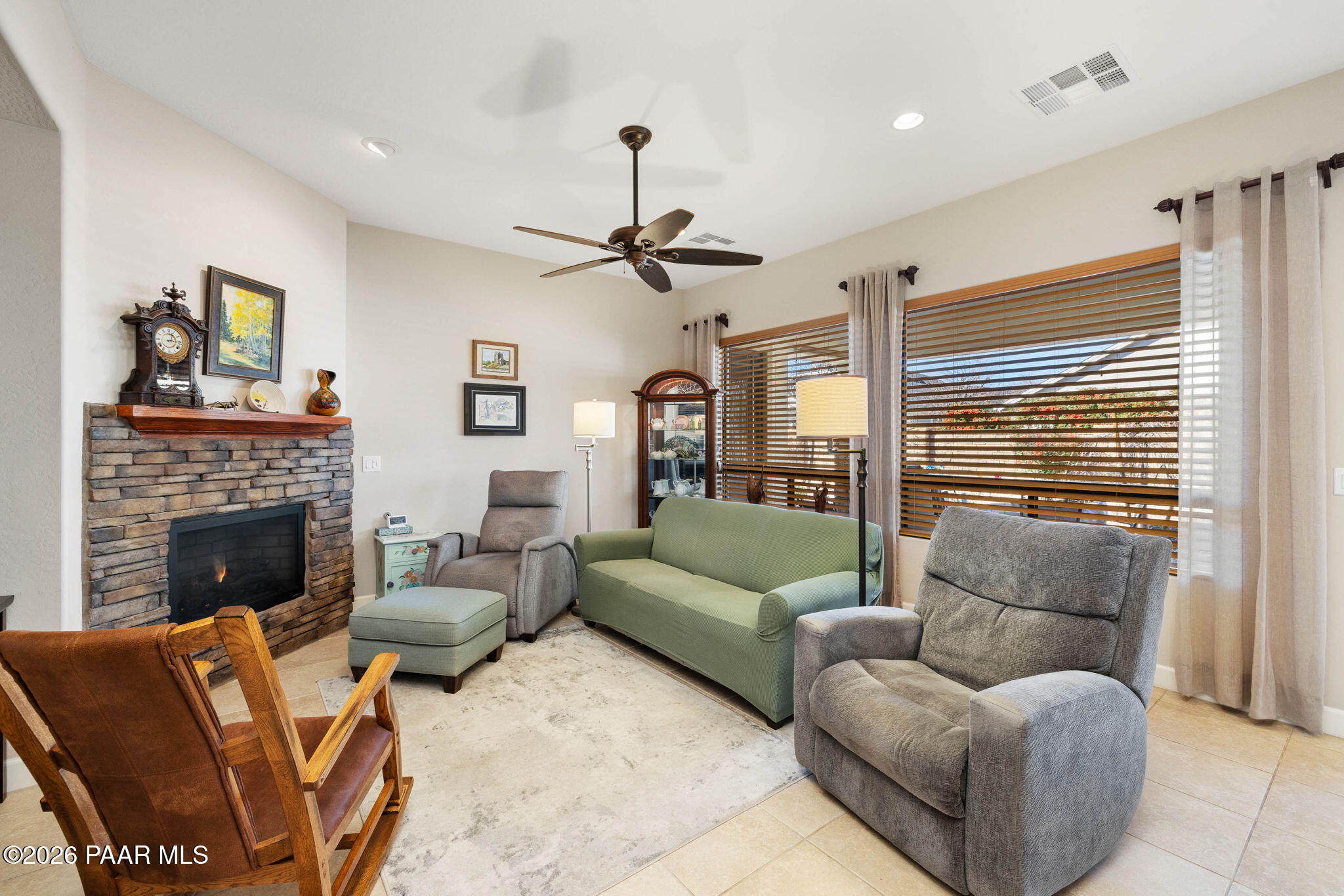 1636 Constable Street Prescott, AZ 86301 - Photo 13 of 41 a living room with furniture a fireplace and a chandelier
