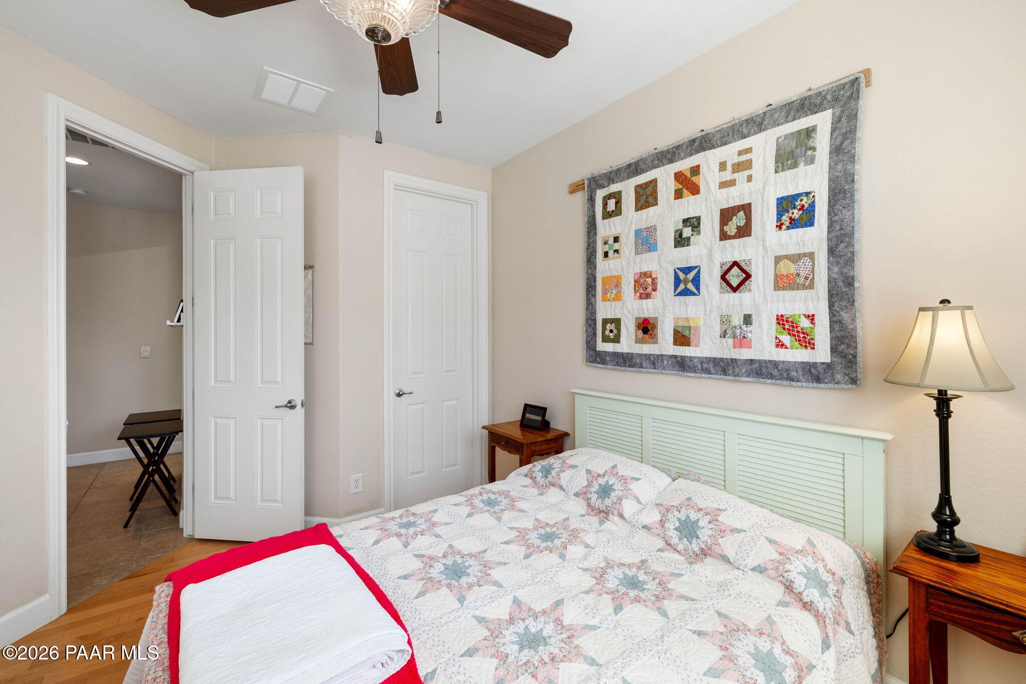 1636 Constable Street Prescott, AZ 86301 - Photo 27 of 41 a bedroom with a bed and a lamp on dresser