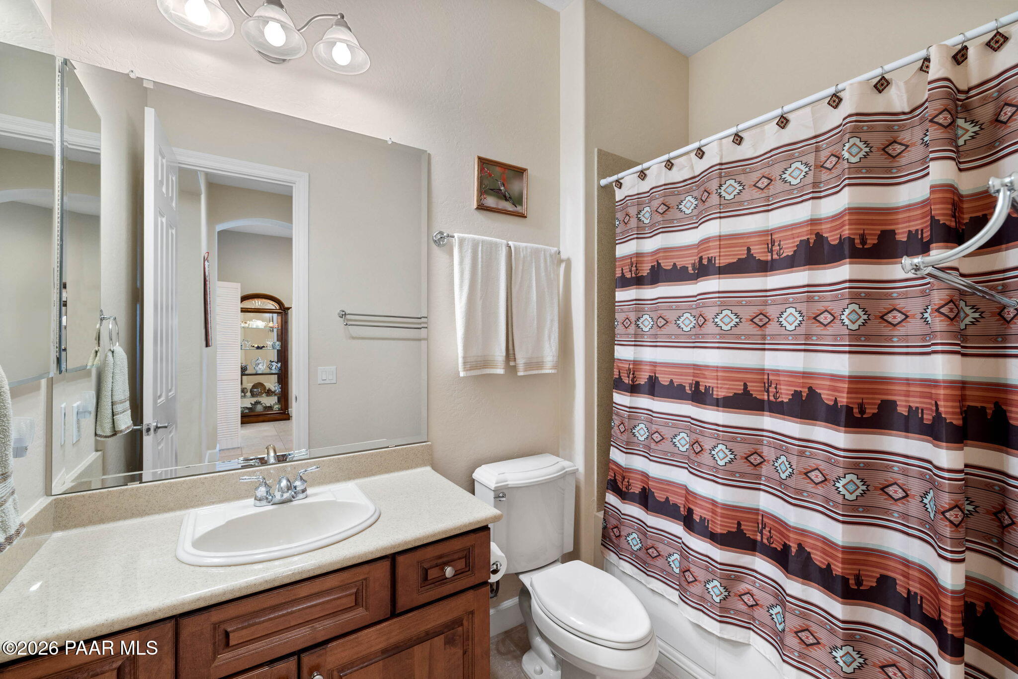 1636 Constable Street Prescott, AZ 86301 - Photo 28 of 41 a bathroom with a granite countertop toilet sink and mirror