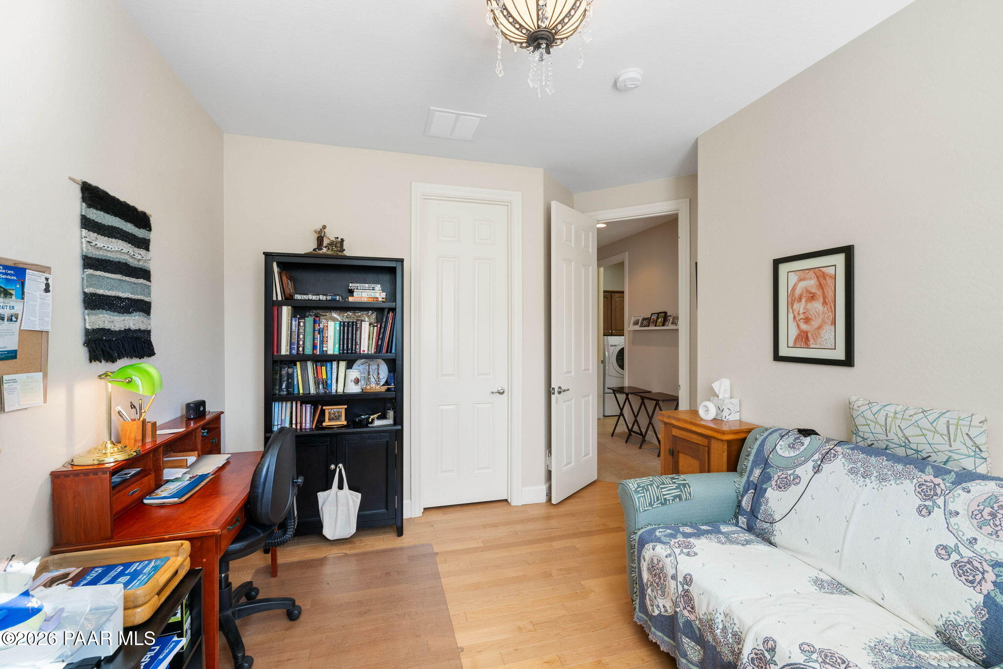 1636 Constable Street Prescott, AZ 86301 - Photo 30 of 41 a living room with furniture a piano and a bookshelf