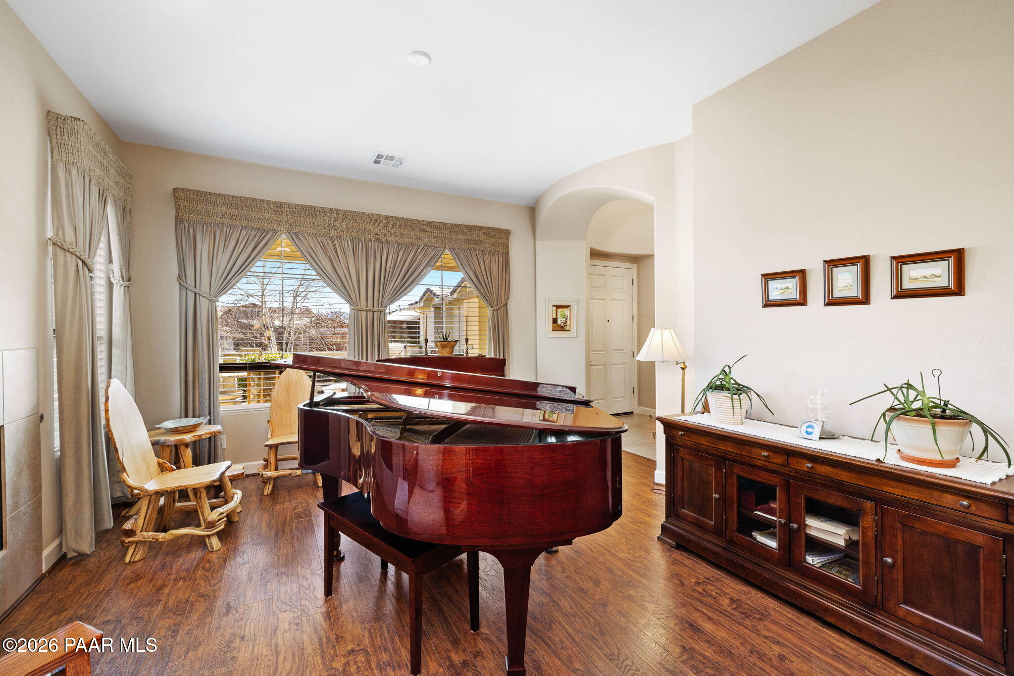1636 Constable Street Prescott, AZ 86301 - Photo 9 of 41 a living room with furniture a fireplace and a large window