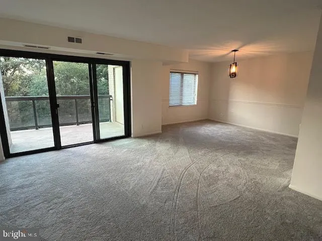 a view of empty room with windows