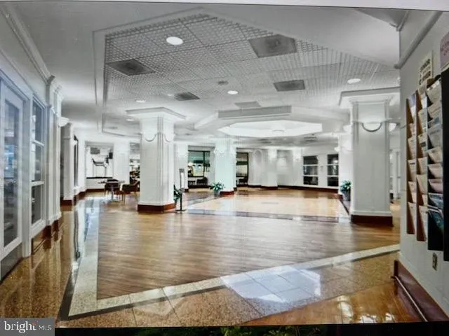 a view of a living room and kitchen with a large window