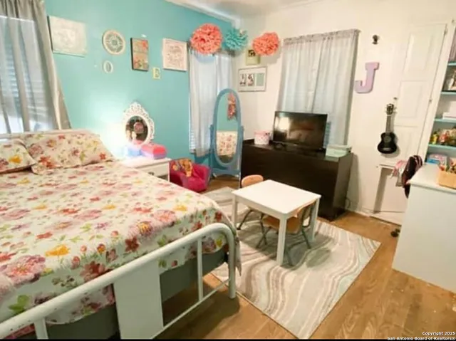 a bedroom with a bed and a table in it