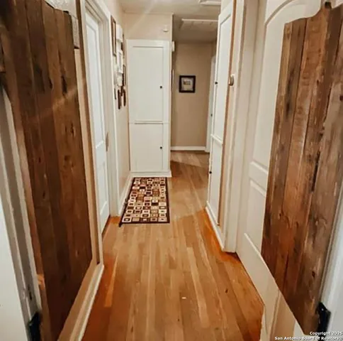 a bathroom with a sink and glass door