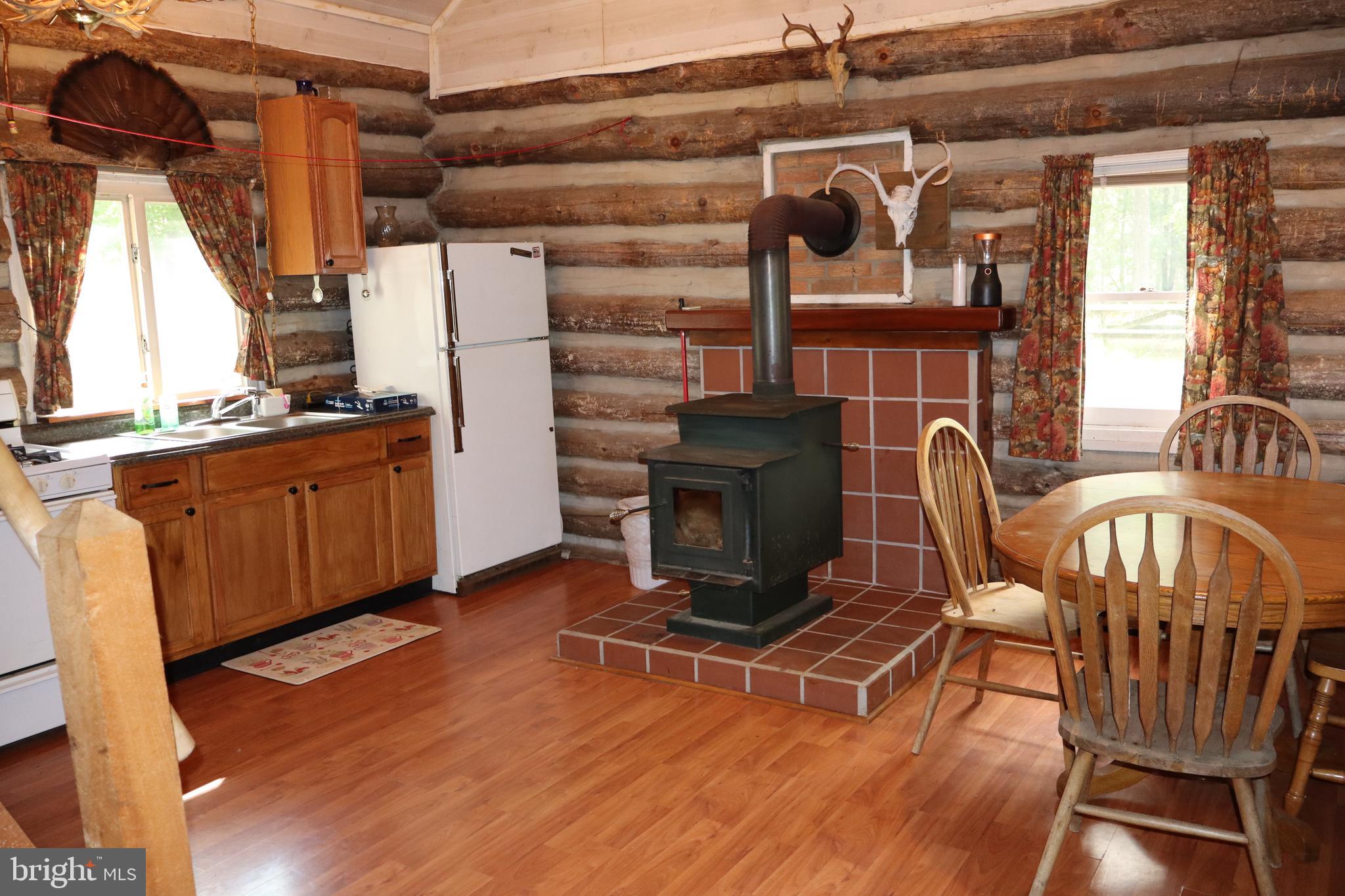 418 R R & R Ridge Road Brandywine, WV 26802 - Photo 12 of 43 a view of a chairs and table in a patio