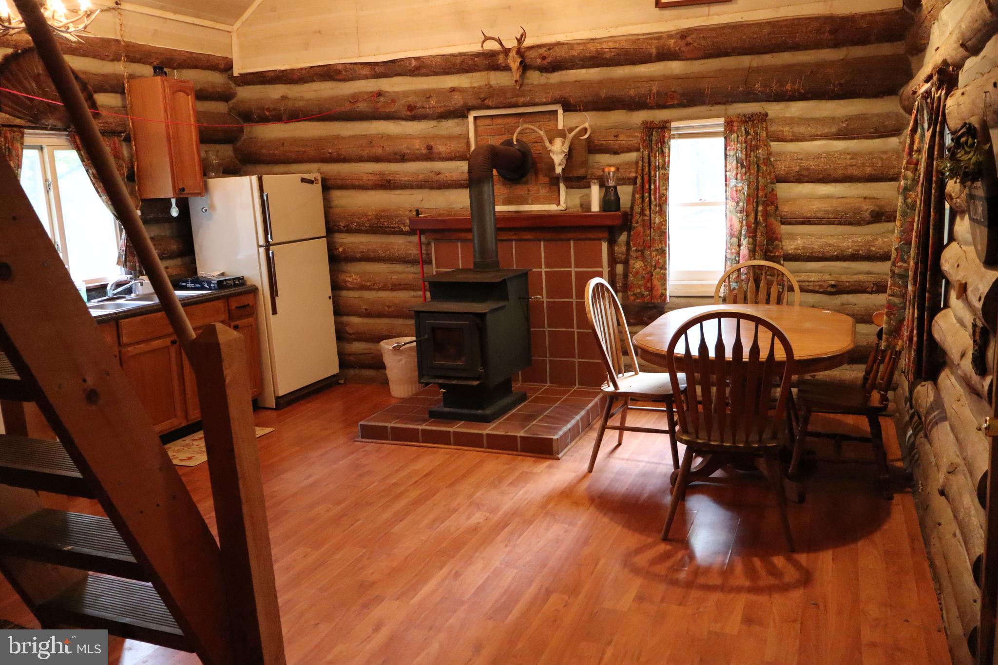 418 R R & R Ridge Road Brandywine, WV 26802 - Photo 9 of 43 a view of a chairs and table in the patio