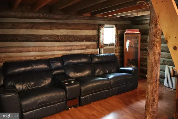 a view of living room with furniture and a couch