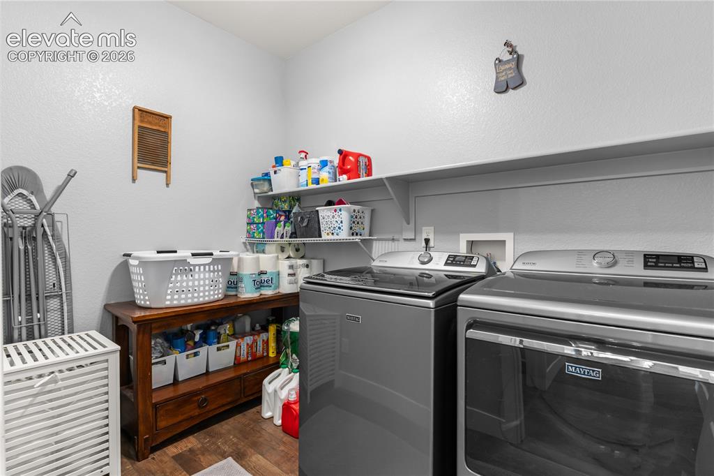12781 Granite Ridge Drive Peyton, CO 80831 - Photo 23 of 41 Main level laundry makes this chore convenient.