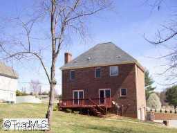Other. Back of home with deck and large yard