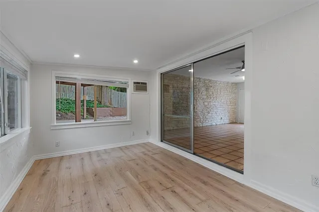 a view of a house with a yard and tree