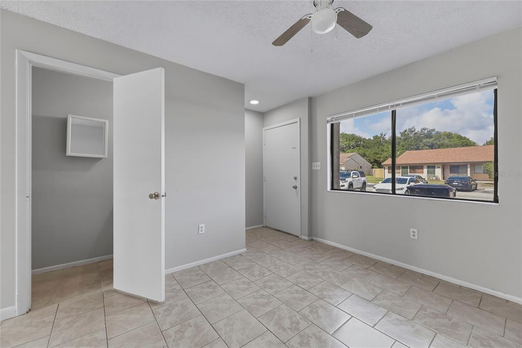 4799 Sisson Road Titusville, FL 32780 - Photo 3 of 23 a view of an empty room with a window