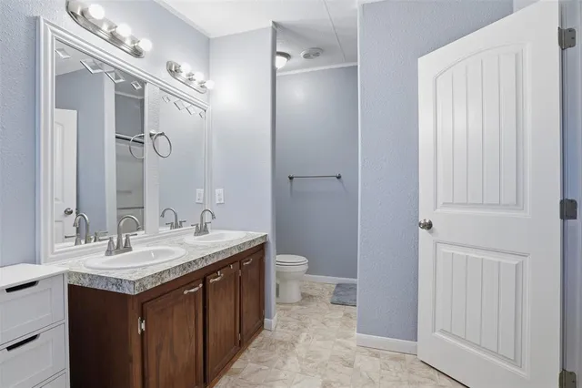 a bathroom with a toilet and a sink