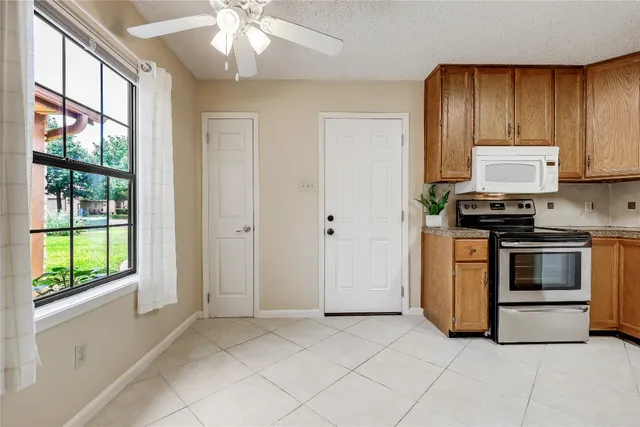 a kitchen with stainless steel appliances a stove a sink and a refrigerator