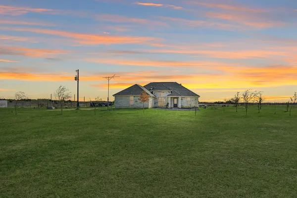 a view of a house with a big yard