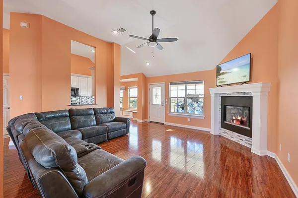 a living room with furniture and a fireplace