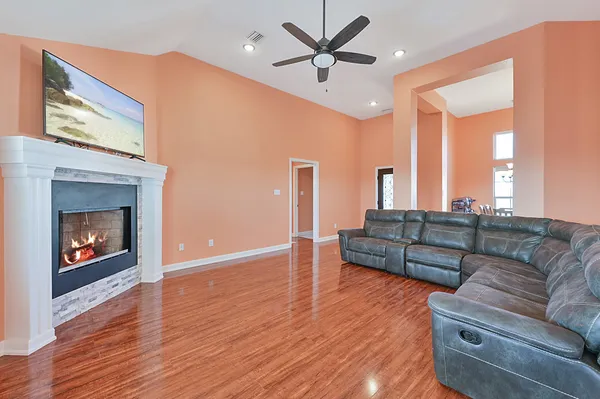 a living room with furniture and a fireplace