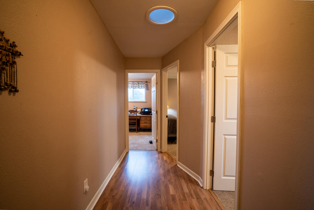 4579 Winnetka Road White City, OR 97503 - Photo 6 of 28 a view of a hallway with wooden floor
