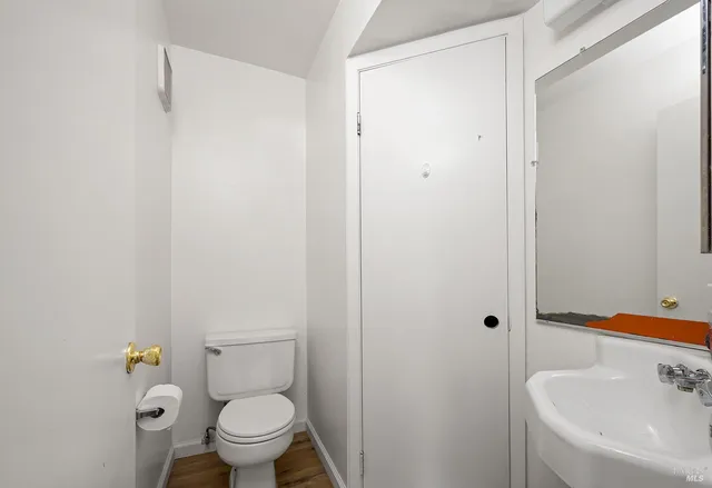 a bathroom with a sink and toilet