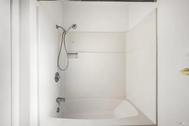 a bathroom with a bath tub