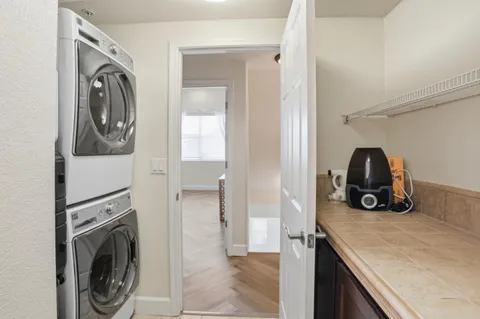 a view of a storage and utility room with washer and dryer