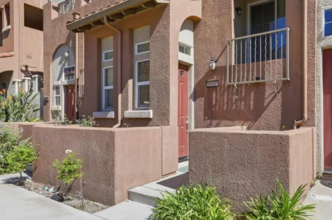 a balcony with a potted plant
