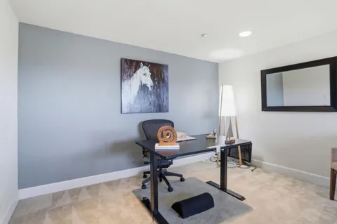 a view of a workspace with furniture