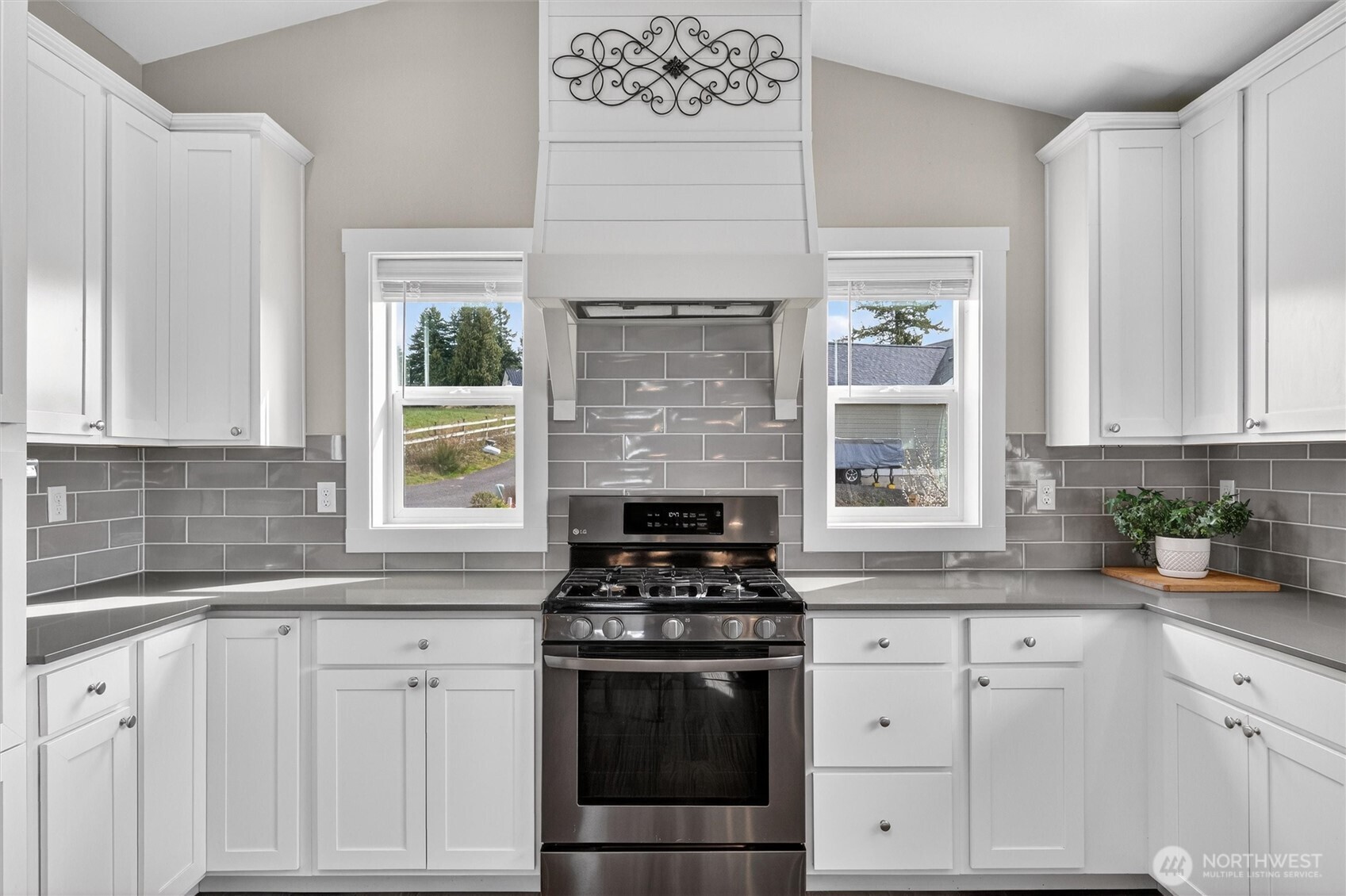 125 Ridgeview Street Sumas, WA 98295 - Photo 14 of 40 a kitchen with white cabinets and appliances