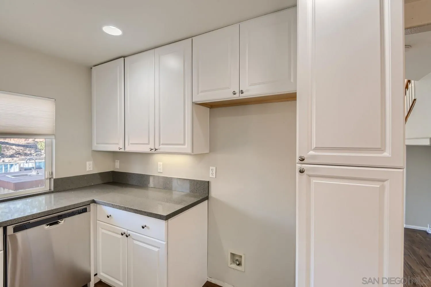 39538 Oak Circle Murrieta, CA 92563 - Photo 13 of 27 a kitchen with granite countertop white cabinets and sink