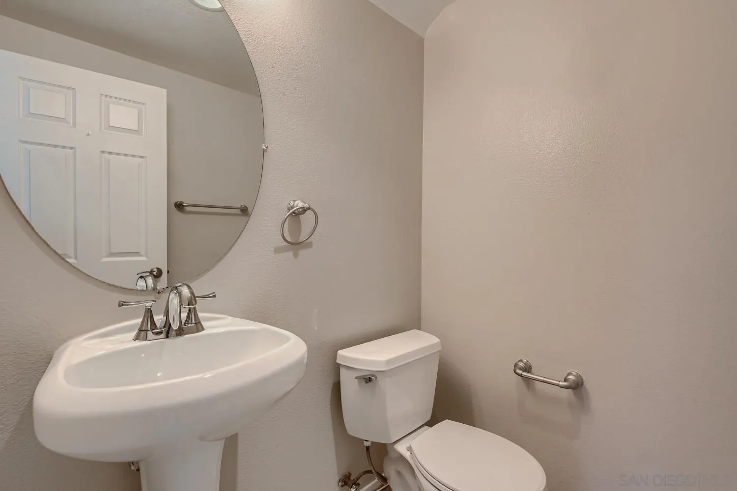 39538 Oak Circle Murrieta, CA 92563 - Photo 14 of 27 a bathroom with a sink a toilet and mirror