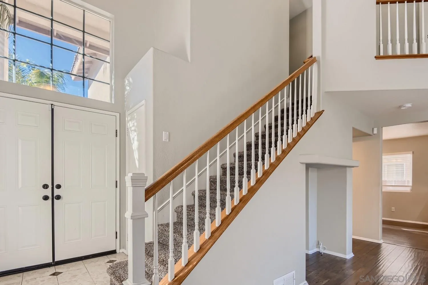 39538 Oak Circle Murrieta, CA 92563 - Photo 15 of 27 a view of staircase with lots of frames on wall and a window