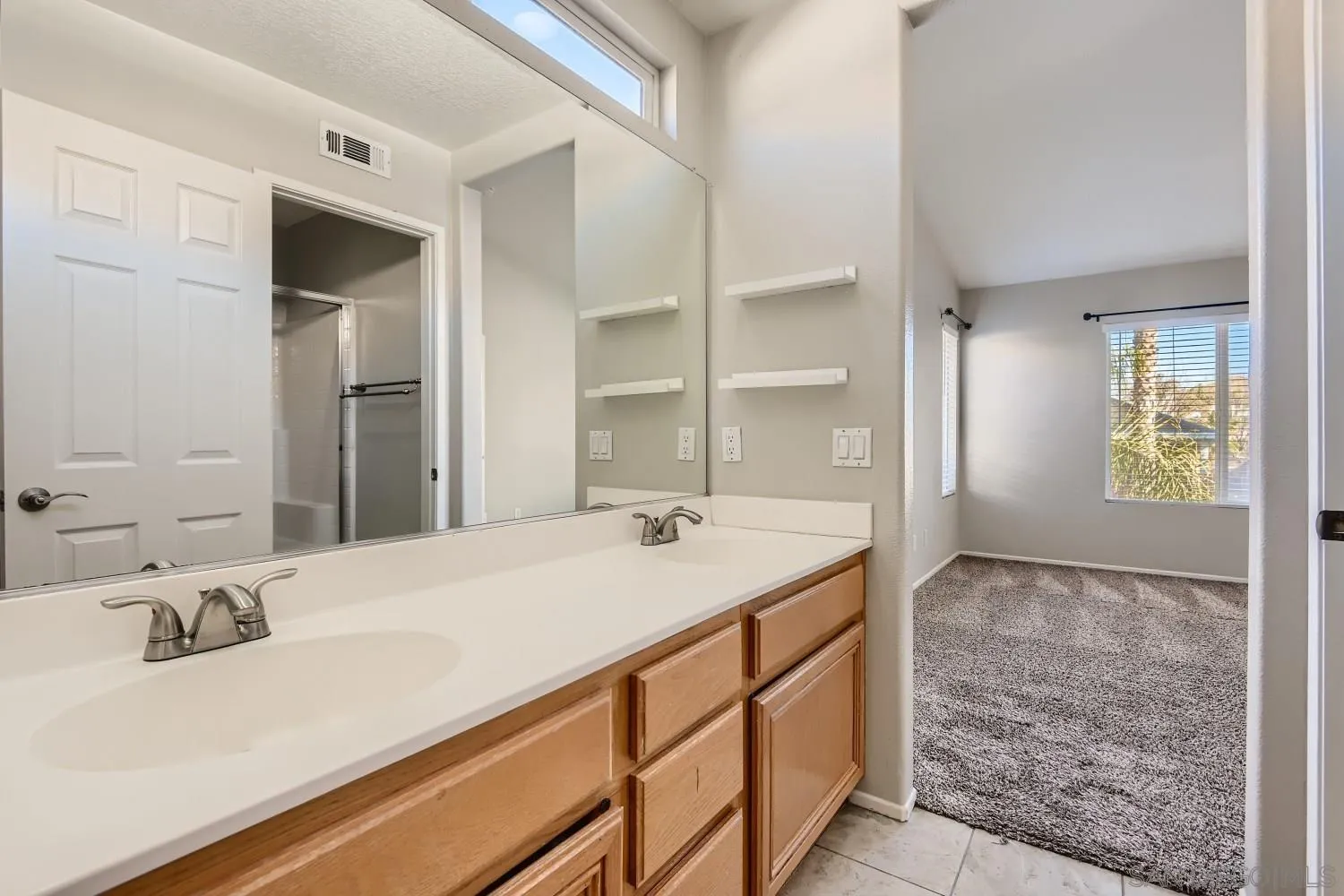 39538 Oak Circle Murrieta, CA 92563 - Photo 20 of 27 a bathroom with a sink and a mirror