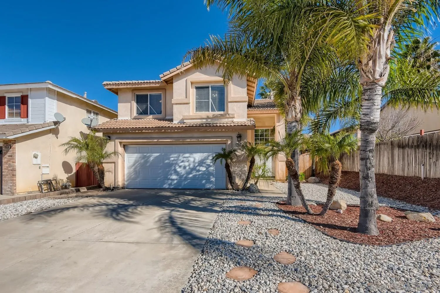 39538 Oak Circle Murrieta, CA 92563 - Photo 2 of 27 a front view of a house with a garden
