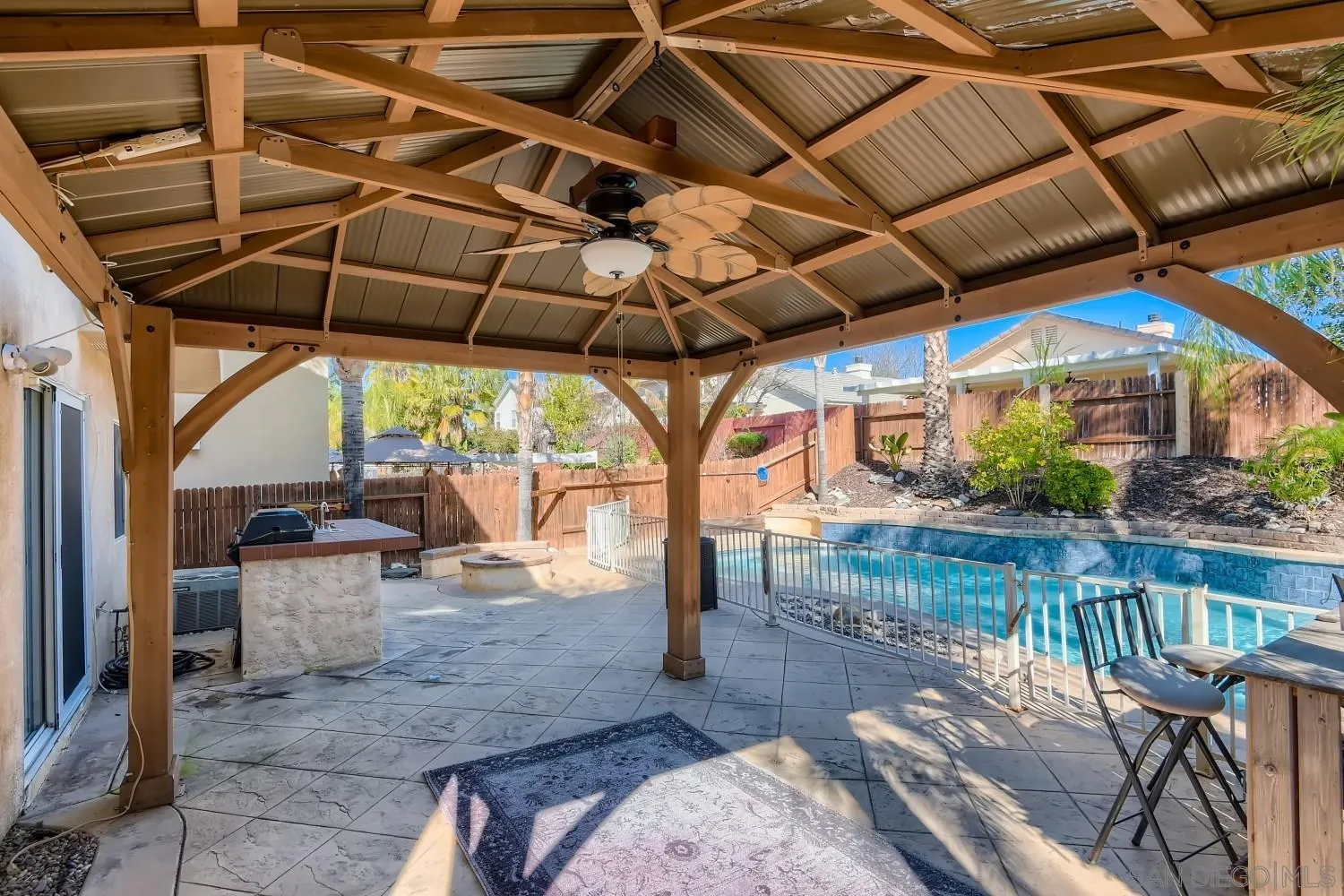 39538 Oak Circle Murrieta, CA 92563 - Photo 25 of 27 a view of a patio with table and chairs potted plants