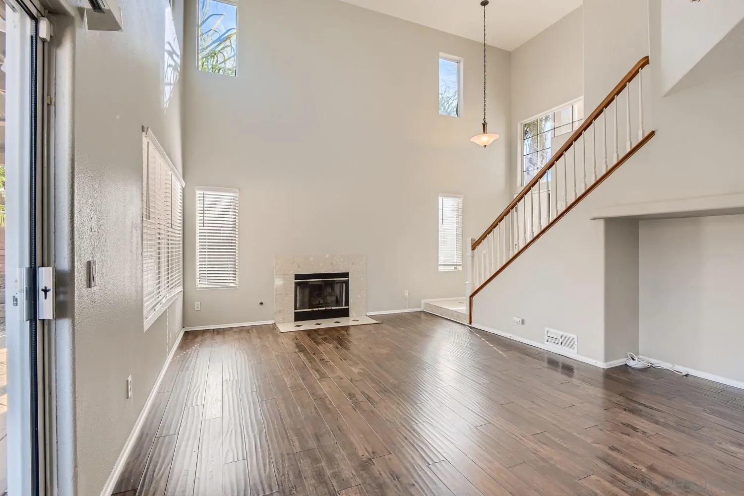 39538 Oak Circle Murrieta, CA 92563 - Photo 8 of 27 a view of empty room with wooden floor and fan