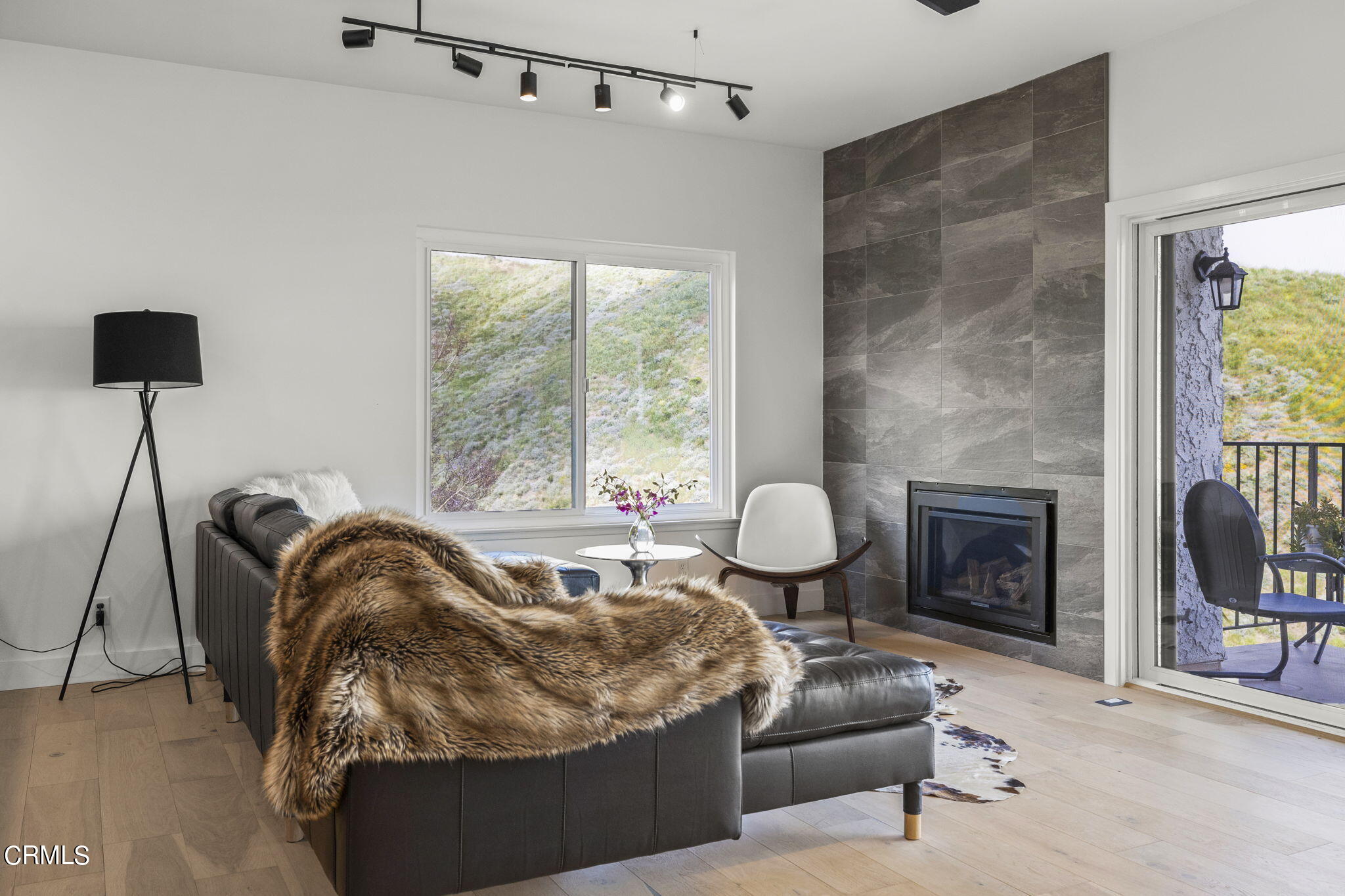 940 Vallecito Drive Ventura, CA 93001 - Photo 14 of 42 a living room with furniture and a fireplace