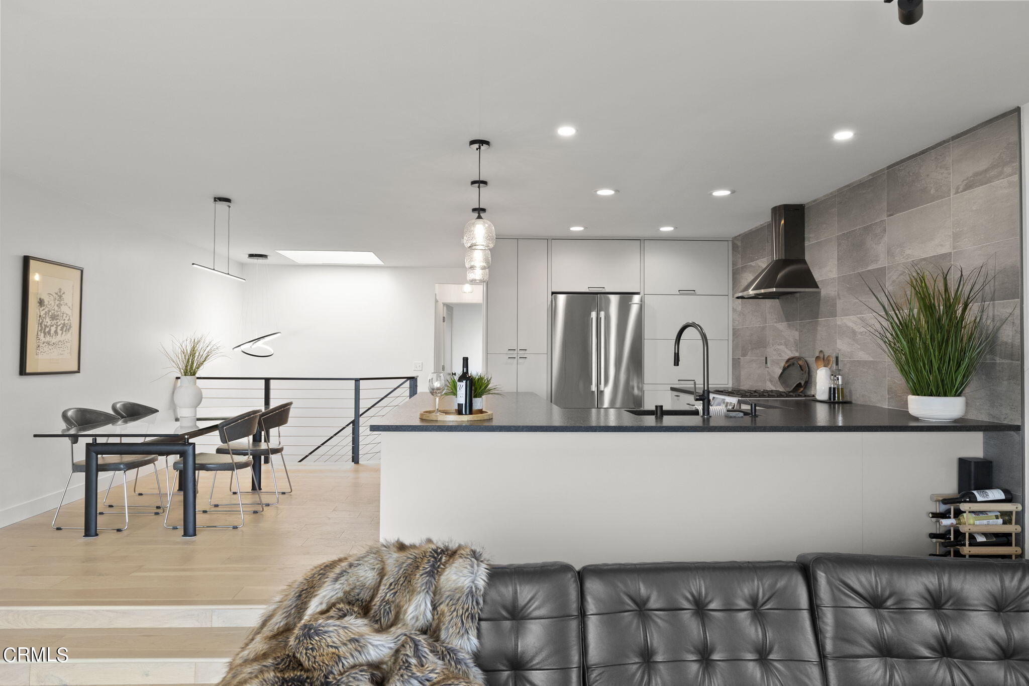 940 Vallecito Drive Ventura, CA 93001 - Photo 16 of 42 a kitchen with stainless steel appliances kitchen island granite countertop a sink a stove and cabinets