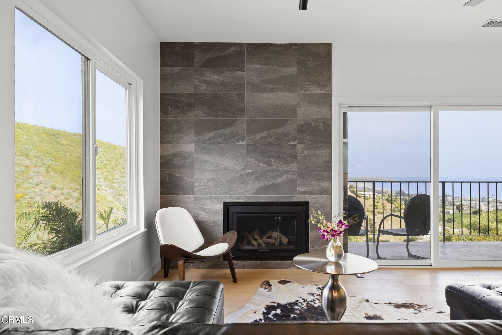 940 Vallecito Drive Ventura, CA 93001 - Photo 17 of 42 a living room with furniture wooden floor and a fireplace