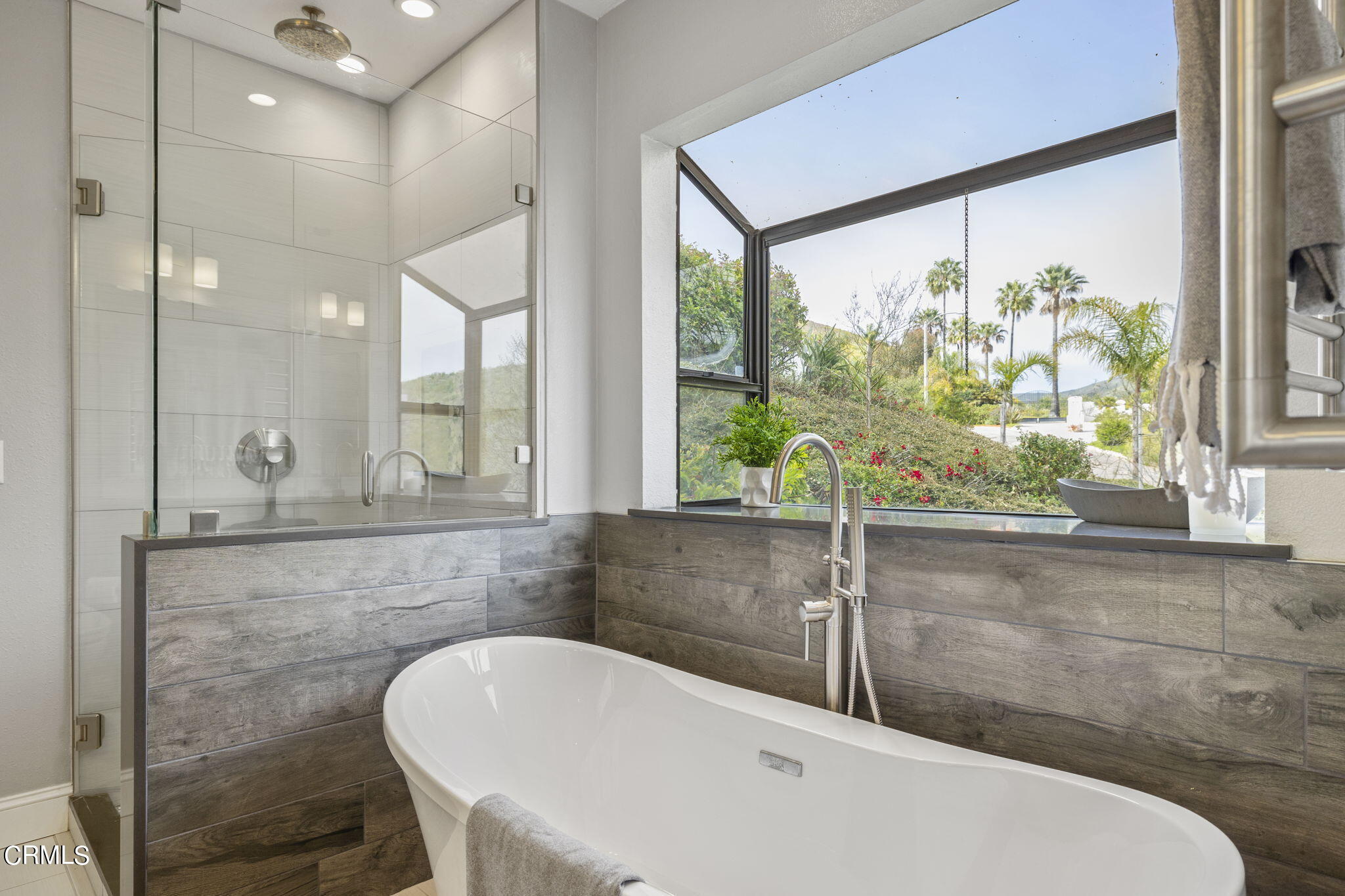 940 Vallecito Drive Ventura, CA 93001 - Photo 33 of 42 a bathroom with a bathtub and shower