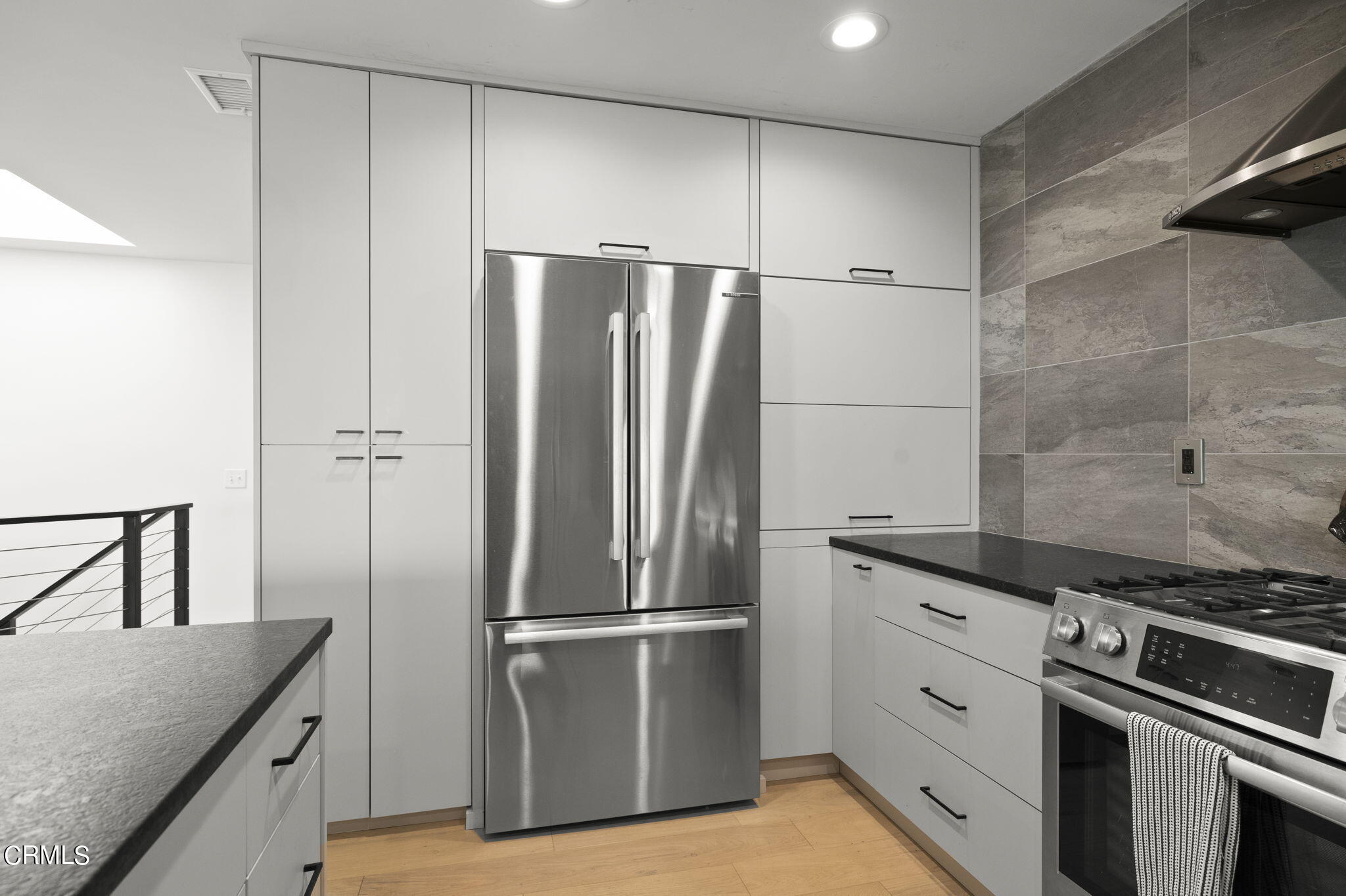 940 Vallecito Drive Ventura, CA 93001 - Photo 10 of 42 a kitchen with stainless steel appliances granite countertop a refrigerator and a stove