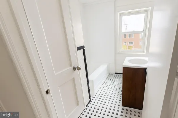 a bathroom with a sink and a shower