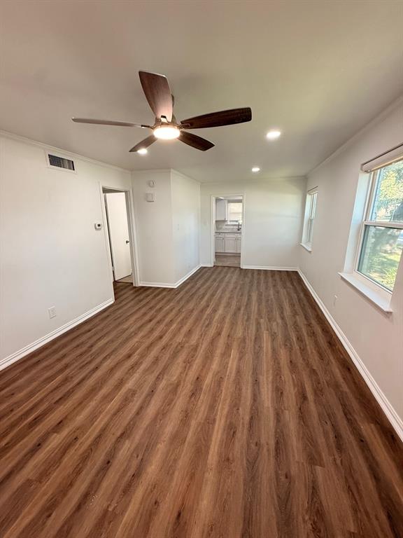 3933 Inwood Road, Unit 1023 Dallas, TX 75209 - Photo 11 of 22 wooden floor in an empty room with a window