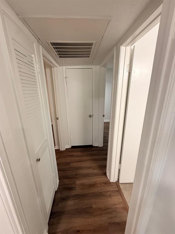 3933 Inwood Road, Unit 1023 Dallas, TX 75209 - Photo 12 of 22 a view of a room with wooden floor and stairs